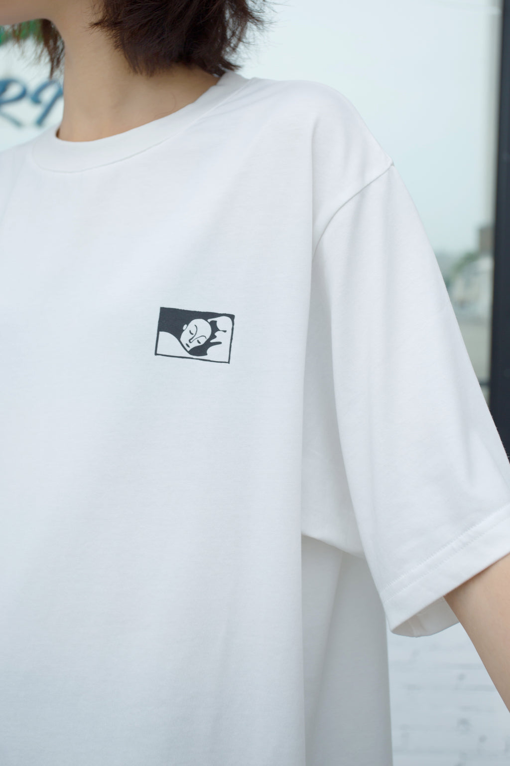 White emblem tee